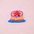 Winking Cake Clear Waterproof Sticker | 2” Cute Dessert Vinyl Decal